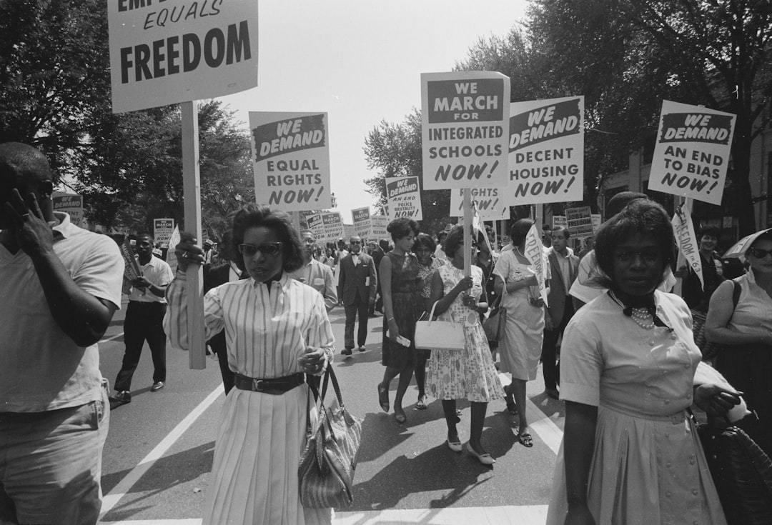 A procession of African Americans carrying signs for equal rights, integrated schools, decent housing, and an end to bias. A procession of African Americans carrying signs for equal rights, integrated schools, decent housing, and an end to bias.