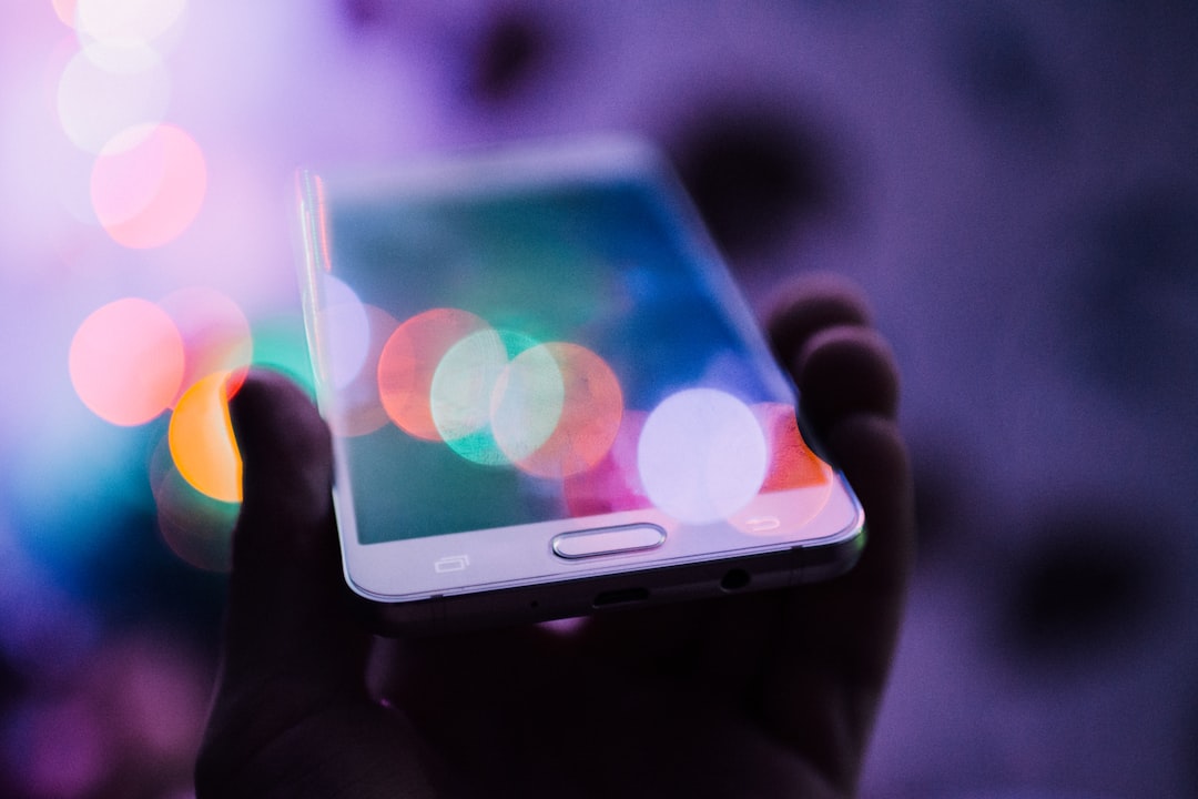 person holding smartphone person holding smartphone