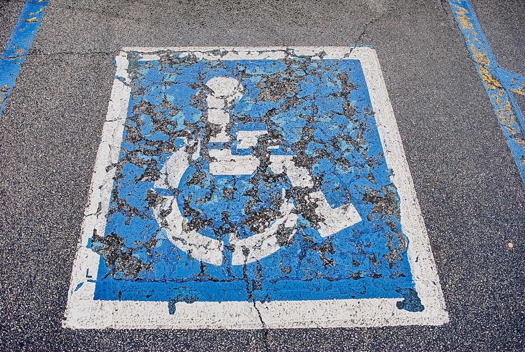 a blue and white sign on the side of a road a blue and white sign on the side of a road
